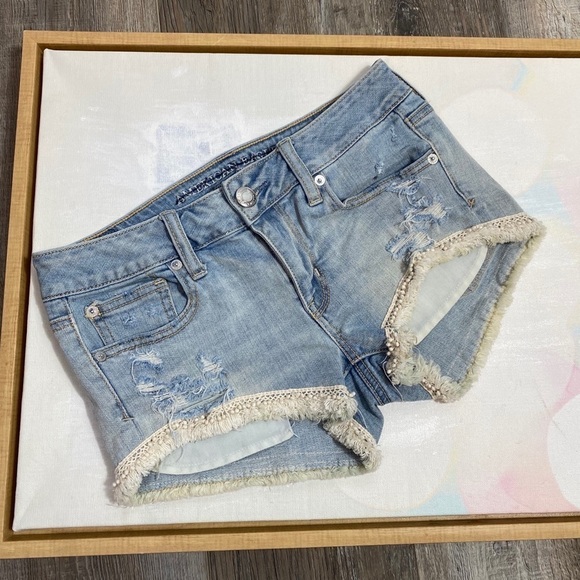 AE 4 shortie pom pom fringe distressed jean shorts - Picture 1 of 8
